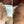 Before and after image of a person with wavy blonde hair and thin hair on their crown and parting line